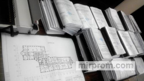 Стопка сброшюрованных томов проектной документации с печатями