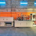 Автоматический станок по производству полиэтиленовых перчаток.